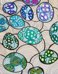 Colorful 3D egg shapes in purple, blue, teal, and green with zentangle wave pattern background